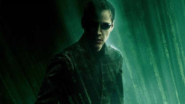 Keanu Reeves in his signature sunglasses as Neo in The Matrix.