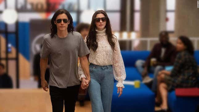 Jared Leto as co-founder Adam Neumann and Anne Hathaway as Adam’s wife Rebekah Neumann walking together in WeCrashed.