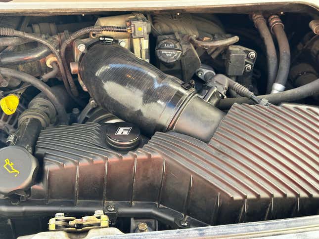 The Porsche M96 engine with a intake resonator delete kit installed.