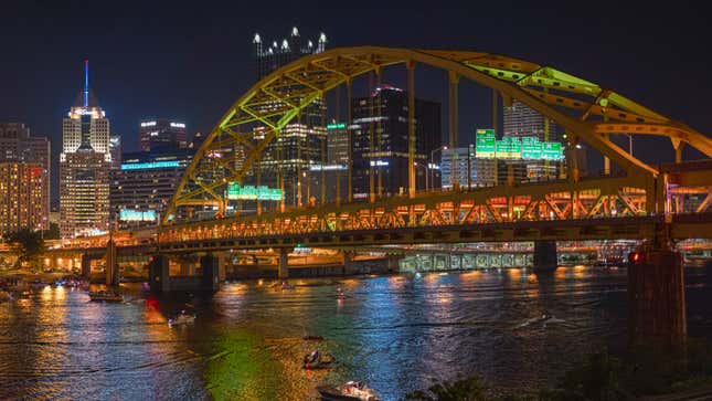 A photo of the Fort Pitt Bridge in Pittsburgh at night time. 
