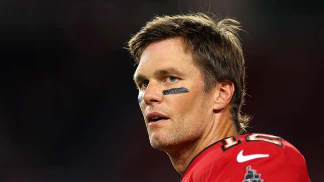 Tom Brady looking to the side with a blank stare