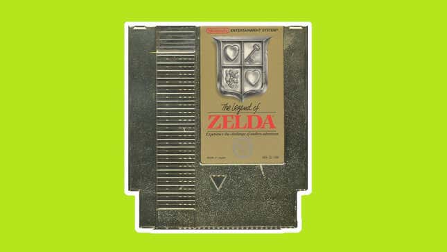 A gold cartridge for the original Legend of Zelda sits in front of a pea green background. 