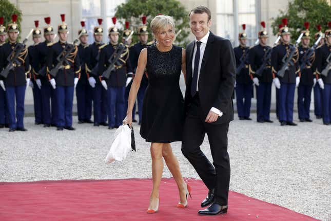 Macron and Trogneux arrive at Paris’s Elysee Palace for a dinner honoring the king and queen of Spain.