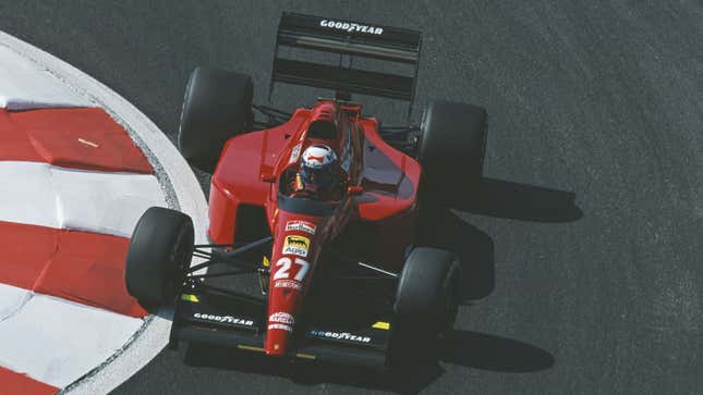 A photo of the 1991 Ferrari Formula 1 car driving round a corner.