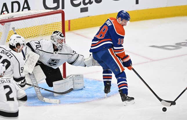 Apr 17, 2023; Edmonton, Alberta, CAN; Los Angeles Kings goalie Joonas Korpisalo (70) defends as Edmonton Oilers left winger Zach Hyman (18) handles the puck during the second period in game one of the first round of the 2023 Stanley Cup Playoffs at Rogers Place.