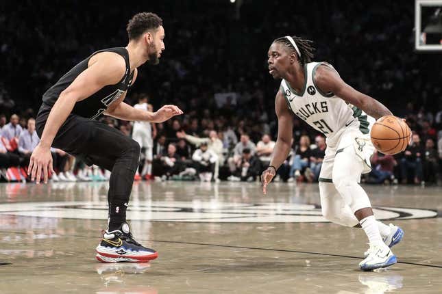 Dec 23, 2022; Brooklyn, New York, USA;  Milwaukee Bucks guard Jrue Holiday (21) looks to drive past Brooklyn Nets guard Ben Simmons (10) in the second quarter at Barclays Center.