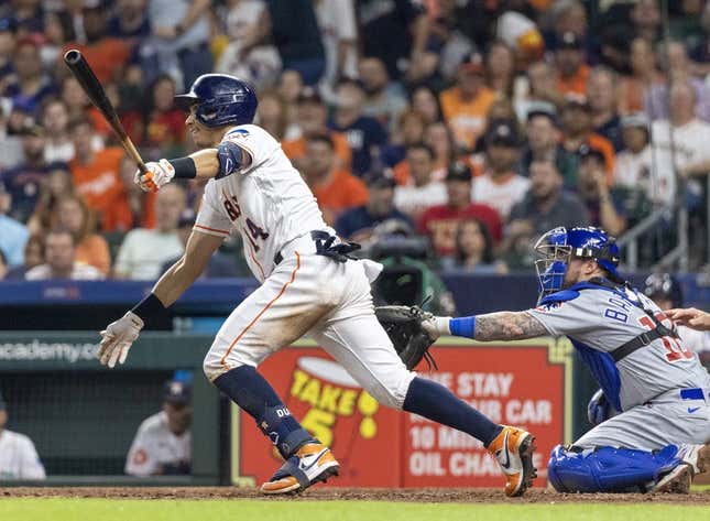May 16, 2023; Houston, Texas, USA; Houston Astros second baseman Mauricio Dubon (14) hits a double against the Chicago Cubs in the seventh inning at Minute Maid Park.