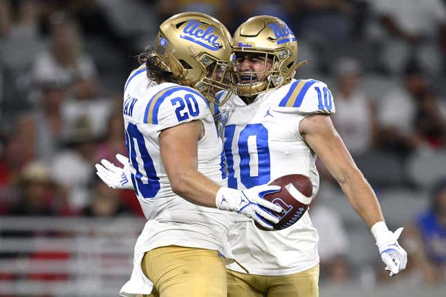 Sep 9, 2023; San Diego, California, USA; UCLA Bruins running back Carsen Ryan (20) celebrates with wide receiver Ryan Cragun (10) after scoring a touchdown against the San Diego State Aztecs during the second half at Snapdragon Stadium.