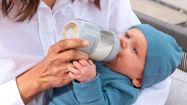 An infant being fed using the Ember Baby Bottle System's bottle.