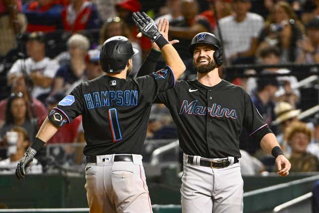 Sep 1, 2023; Washington, District of Columbia, USA; Miami Marlins center fielder Garrett Hampson (1) is congratulated by shortstop Jon Berti (5) after hitting a two run home run during the eleventh inning against the Washington Nationals at Nationals Park.