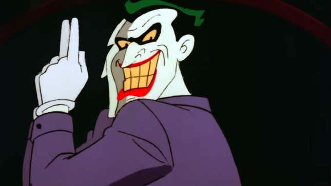 The Joker points his index finger up, giving the most disturbing grin while turning his back. Creepy.