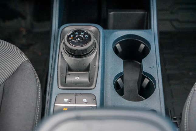The gear knob and cup holder of the 2023 Ford Maverick XL
