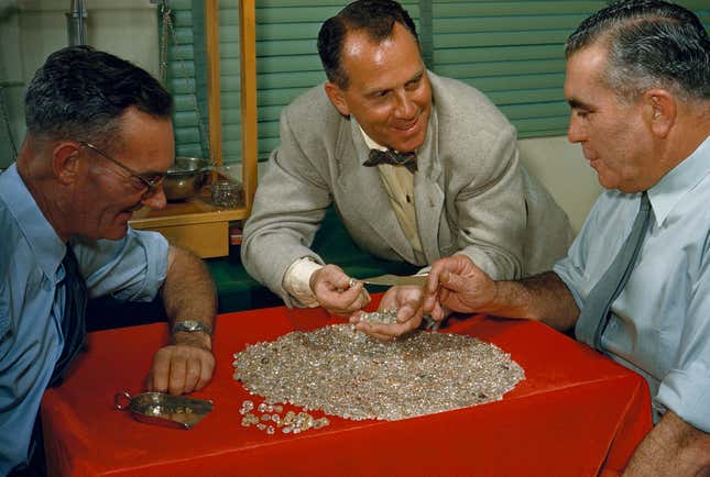 A pile of uncut diamonds in 1955 Oranjemund, Namibia. Debmarine sorts its diamonds in the same town today.