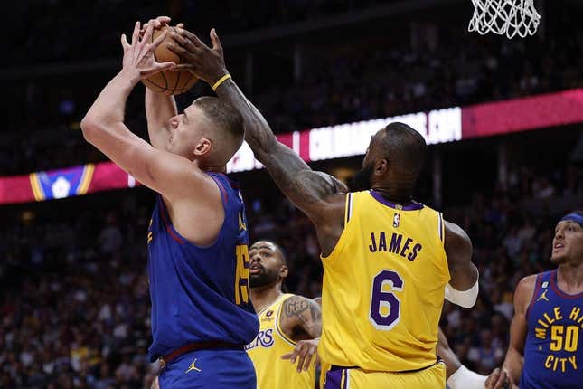 May 16, 2023; Denver, Colorado, USA; Los Angeles Lakers forward LeBron James (6) defends against Denver Nuggets center Nikola Jokic (15) in the second quarter during game one of the Western Conference Finals for the 2023 NBA playoffs at Ball Arena.