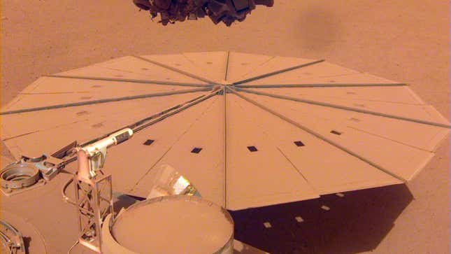 InSight's solar panel, covered in orange Martian dust.