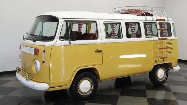 A photo of a bright yellow classic VW bus.
