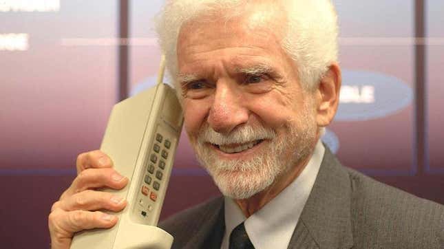 Martin Cooper, the father of cell phones, is shown with a DynaTAC prototype.