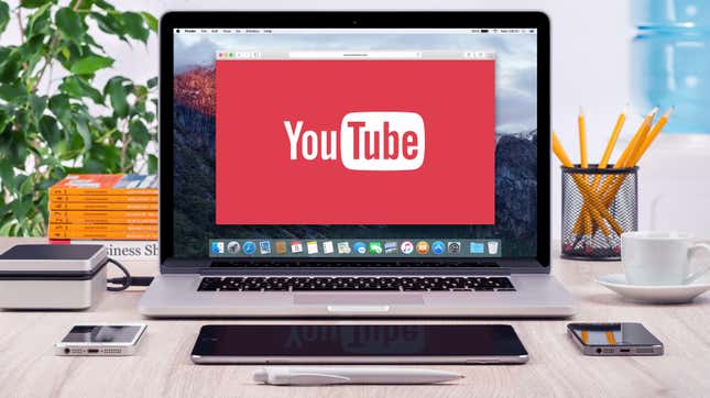 A YouTube logo on an open laptop screen