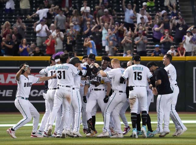 Jun 1, 2023; Phoenix, Arizona, USA; Arizona Diamondbacks left fielder Corbin Carroll (7) celebrates his walk off two RBI single against the Colorado Rockies during the ninth inning at Chase Field.