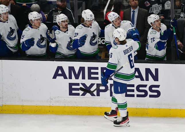 Mar 18, 2023; Los Angeles, California, USA; Vancouver Canucks right wing Brock Boeser (6) celebrates with teammates after scoring a goal against the Los Angeles Kings in a NHL game at Crypto.com Arena.