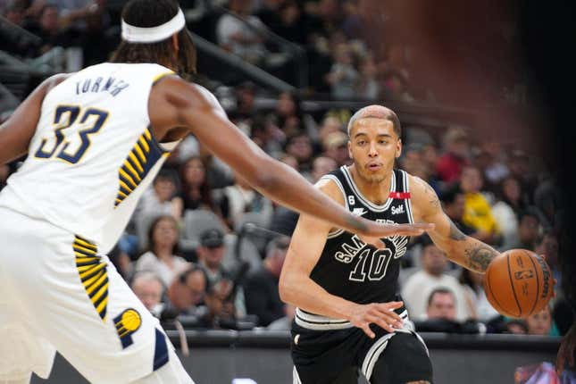 Mar 2, 2023; San Antonio, Texas, USA; San Antonio Spurs forward Jeremy Sochan (10) dribbles against Indiana Pacers center Myles Turner (33) in the second quarter at AT&amp;amp;T Center.
