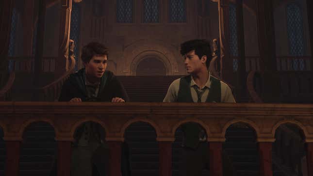 A student is seen talking to Sebastian as they look down at something below.
