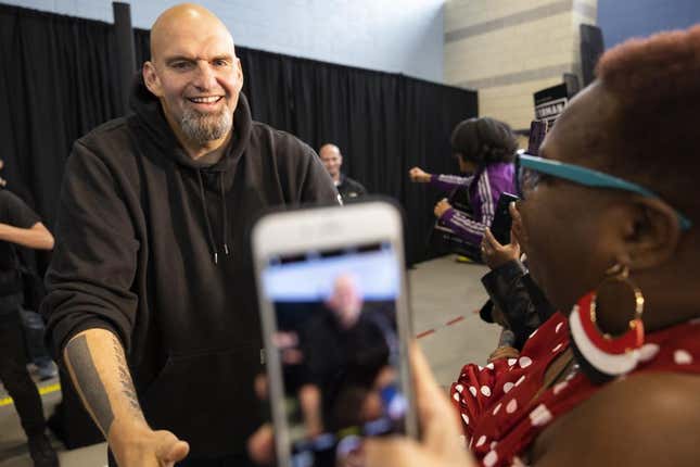 Pennsylvania Lt. Gov. John Fetterman, left, a Democratic candidate for U.S. Senate, greets supporters as he enters his event in Philadelphia, Saturday, Sept. 24, 2022. Black voters are at the center of an increasingly competitive battle in a race that could tilt control of the Senate between Fetterman and Republican Mehmet Oz, as Democrats try to harness outrage over the Supreme Court’s abortion decision and Republicans tap the national playbook to focus on rising crime in cities.