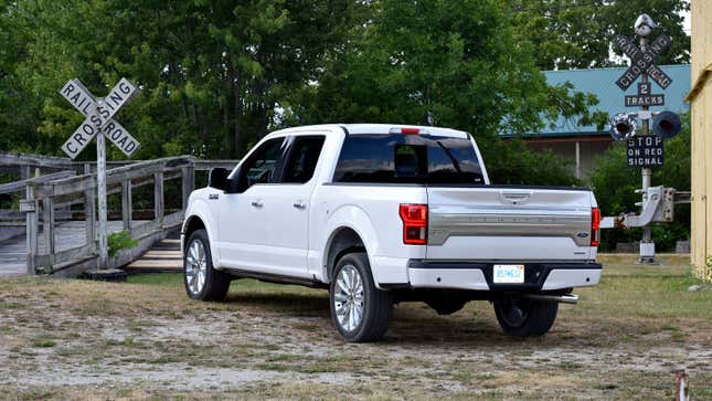 A photo of a white Ford F-150 pickup truck. 