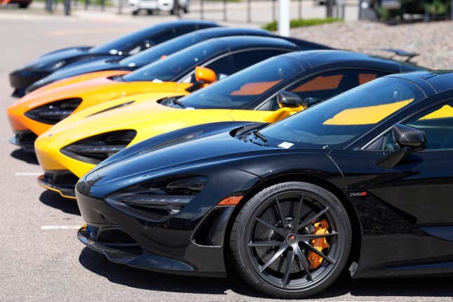 A line of used luxury sports coupes sits outside at a McLaren dealership Sunday, Aug 27, 2023, in Highlands Ranch, Colo. Inflation in the United States edged up in July after 12 straight months of declines. (AP Photo/David Zalubowski)