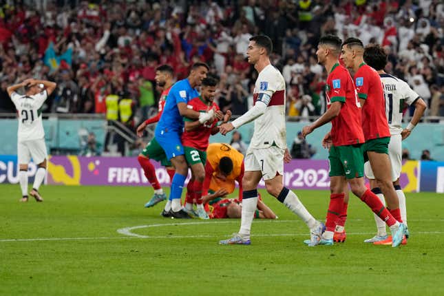 Cristiano Ronaldo walks off pitch after Portugal falls to Morocco in World Cup quarterfinals.