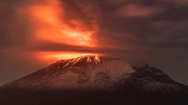 Popocatepetl volcano spews incandescent material as seen from Paso de Cortés on May 23, 2023 in Amecameca, Mexico.