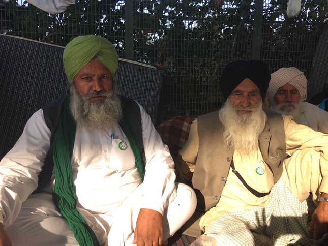 Surjeet Singh (left) sat with another farmer who also came from Sangrur, Punjab.