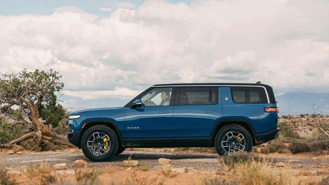 A photo of a blue Rivian R1S SUV. 