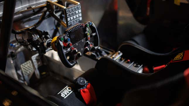 A photo of the seat and steering wheel in the CR-V race car. 