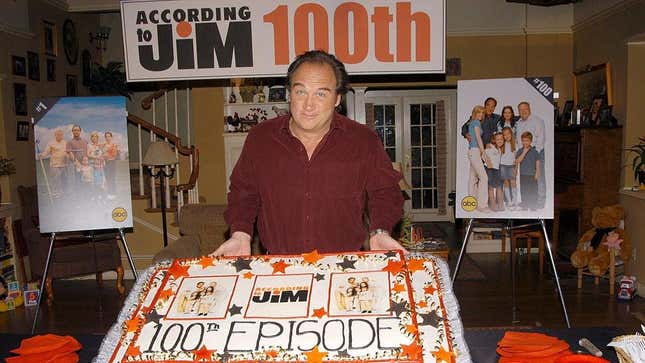 Jim Belushi poses with cake that reads "100 EPISODES"