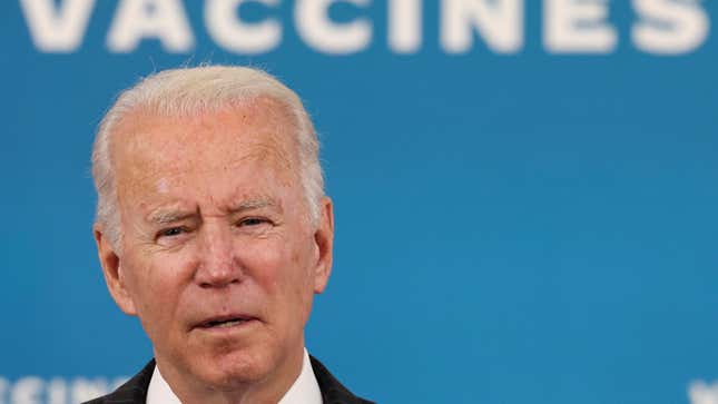 US president Joe Biden against a blue backdrop that reads "vaccines"