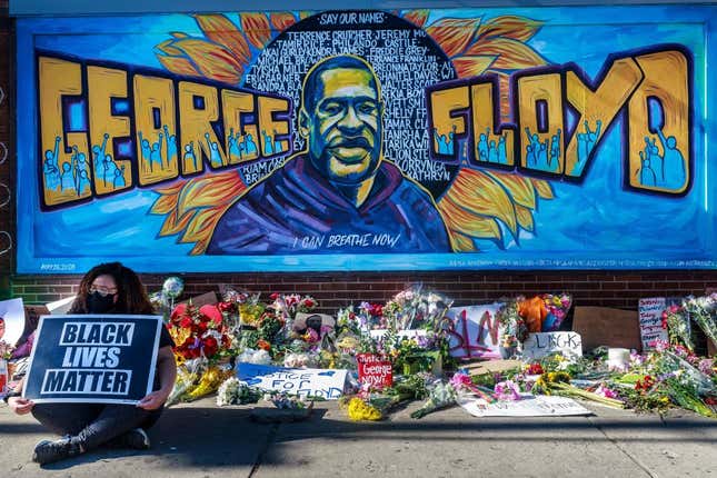 Flowers, signs and balloons are left near a makeshift memorial to George Floyd near the spot where he died while in custody of the Minneapolis police, on May 29, 2020 in Minneapolis, Minnesota.