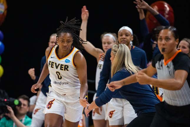 Jun 4, 2023; Indianapolis, Indiana, USA; Indiana Fever guard Kelsey Mitchell (0) celebrates a three point basket with the bench in the second half against the Las Vegas Aces at Gainbridge Fieldhouse.