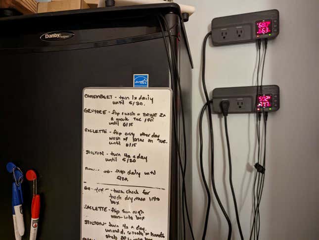 My cheese cave stack, with a reminder board of what’s inside. The Inkbird controllers show the temp and humidity in my caves. 