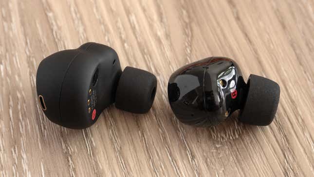 A single Sony WF-1000XM5 wireless earbud sitting next to a single Sony WF-1000XM4 wireless earbud.