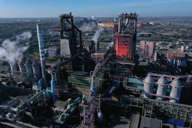 Twin blast furnaces for melting iron stand at the Thyssenkrupp Steel Europe steelworks in Duisburg, Germany in 2021.