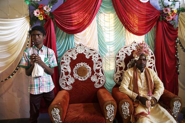 A groom waits for his bride to enter the main wedding hall at a Hindu Sidi wedding in the village of Idgundi.