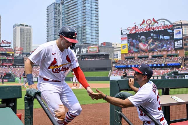 Jul 16, 2023; St. Louis, Missouri, USA;  St. Louis Cardinals catcher Andrew Knizner (7) is congratulated by manager Oliver Marmol (37) after scoring against the Washington Nationals during the fourth inning at Busch Stadium.