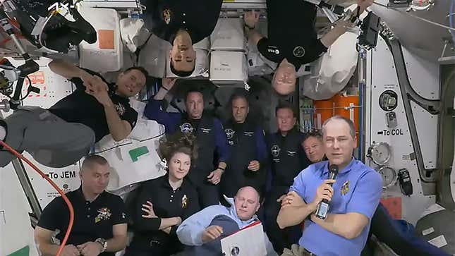 Eleven astronauts now occupy the ISS. The four Axiom crew members are standing (floating?) upright at the back. 