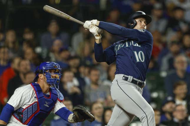 Apr 10, 2023; Chicago, Illinois, USA; Seattle Mariners left fielder Jarred Kelenic (10) hits a solo home run against the Chicago Cubs during the ninth inning at Wrigley Field.