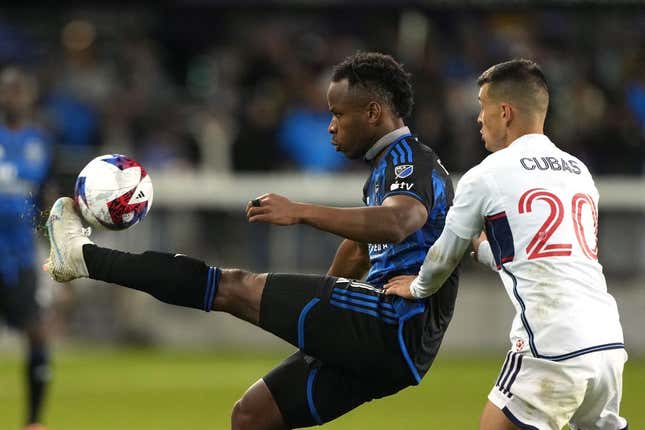 Mar 4, 2023; San Jose, California, USA; San Jose Earthquakes forward Jeremy Ebobisse (11) controls the ball against Vancouver Whitecaps midfielder Andres Cubas (20) during the second half at PayPal Park.