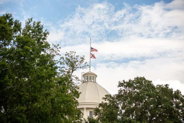 MONTGOMERY, AL - JULY 26: Flags fly at half-staff at the Alabama State Capitol on July 26, 2020, in Montgomery, Alabama.