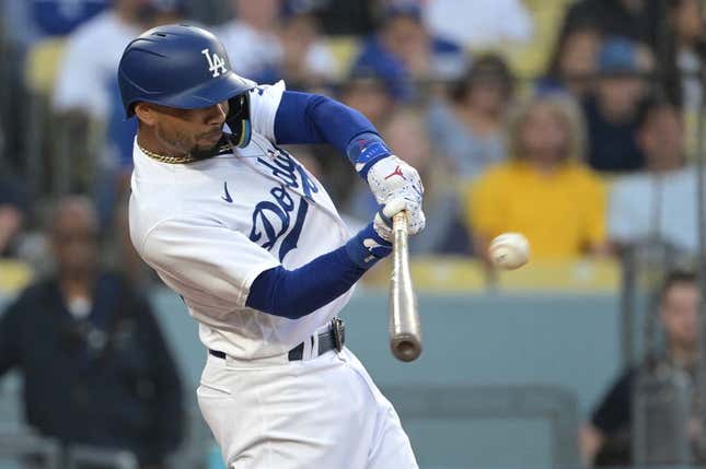 Jul 7, 2023; Los Angeles, California, USA; Los Angeles Dodgers right fielder Mookie Betts (50) hits a solo home run in the third inning against the Los Angeles Angels at Dodger Stadium.