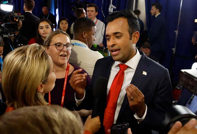 Entrepreneur and author Vivek Ramaswamy speaks to a reporter in the Spin Room following the first Republican Presidential primary debate at the Fiserv Forum in Milwaukee, Wisconsin, on August 23, 2023. 
