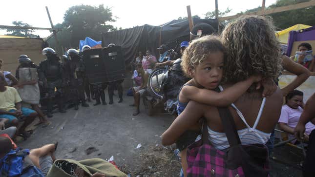 Riot police evict squatters in 2014 from abandoned buildings on a site destined for Olympic construction.